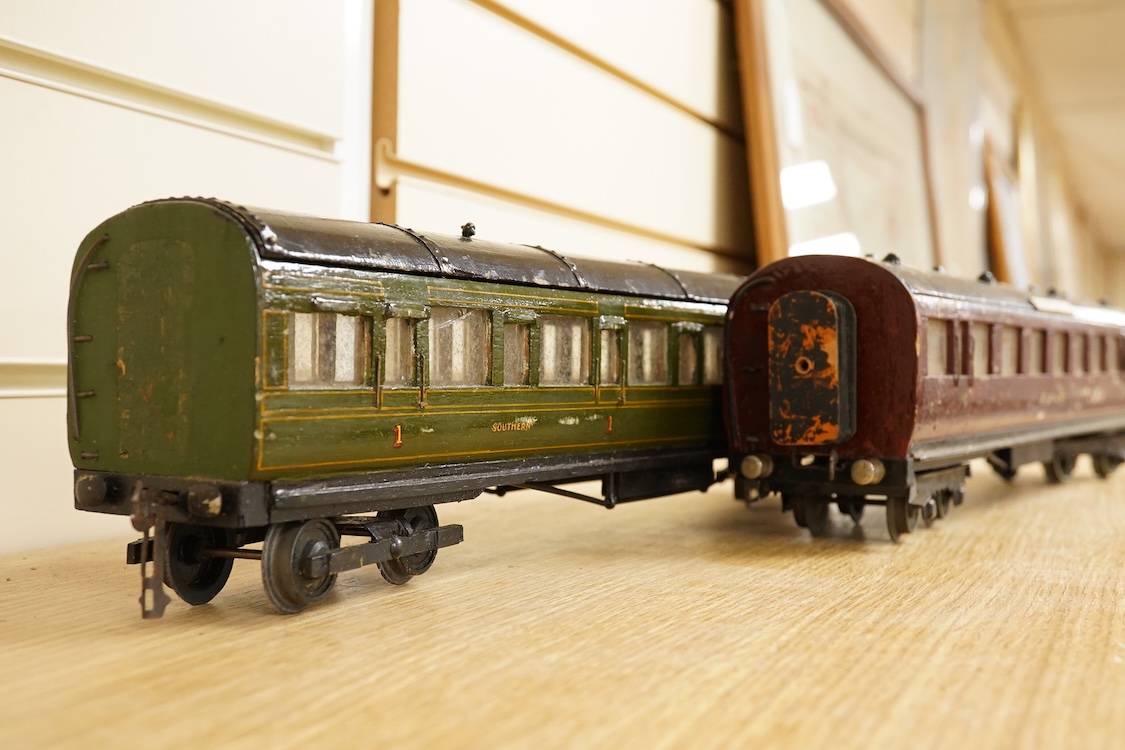 Four 0 gauge 1930s wooden Bonds bogie coaches; three Southern Railway; a Composite Brake, and two First Third Composites, and an LMS First Third Composite